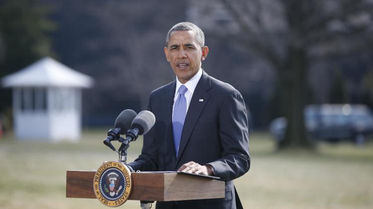 President Barack Obama makes a statement on Ukraine, Thursday, March 20, 2014, on the South Lawn at the White House in Washington before departing for Florida. President Barack Obama said the US is levying a new round of economic sanctions on individuals in Russia, both inside and outside the government, in retaliation for the Kremlin&#39;s actions in Ukraine. He also said he has also signed a new executive order that would allow the U.S. to sanction key sectors of the Russian economy. (AP Photo/Charles Dharapak)