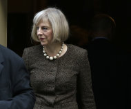 Britain's Home Secretary Theresa May leaves 10 Downing Street in London, Tuesday, Oct. 16, 2012, following a cabinet meeting. Britain's Home Secretary is set to rule on whether to extradite a British hacker to America later today, to face charges for breaking into sensitive computer networks at U.S. military and space installations. (AP Photo/Alastair Grant)