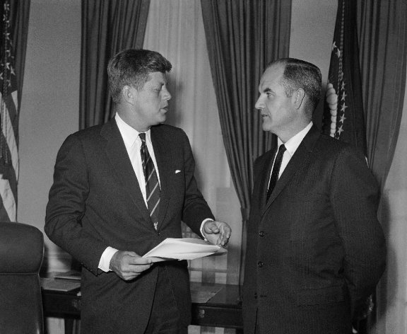 FILE - In this Jan. 24, 1961 file photo, President John F Kennedy talks, with George McGovern, right, a special presidential assistant who also is director of the Food for Peace program, at the White House in Washington. A family spokesman said he passed away peacefully, surrounded by family and life-long friends early Sunday morning Oct. 21, 2012. He was 90. (AP Photo, File)