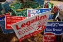 DC Cannabis Campaign sign is seen with other signs in Washington