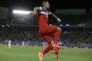 United States' Clint Dempsey leaps as he celebrates after scoring the opening goal during the group G World Cup soccer match between Ghana and the United States at the Arena das Dunas in Natal, Brazil, Monday, June 16, 2014. (AP Photo/Ricardo Mazalan)
