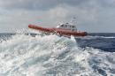 A coast guard boat patrols in the sea near Italy's Lampedusa harbour on October 5, 2013