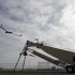This photo taken March 26, 2013, shows an Insitu ScanEagle unmanned aircraft launched at the airport in Arlington, Ore.  It’s a good bet that in the not-so-distant future aerial drones will be part of Americans’ everyday lives, performing countless useful functions. A far cry from the killing machines whose missiles incinerate terrorists, these generally small unmanned aircraft will help farmers more precisely apply water and pesticides to crops, saving money and reducing environmental impacts. They’ll help police departments to find missing people, reconstruct traffic accidents and act as lookouts for SWAT teams. They’ll alert authorities to people stranded on rooftops by hurricanes, and monitor evacuation flows.  (AP Photo/Don Ryan)