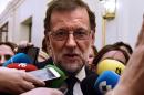 Mariano Rajoy speaks to journalists after being re-elected during the parliamentary investiture vote for a prime minister, at the Spanish Congress (Las Cortes) on October 29, 2016