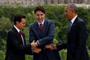 Mexico's President Pena Nieto, Canada's PM Trudeau and U.S. President Obama shake hands at the North American Leaders' Summit in Ottawa