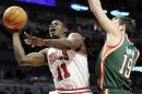 Chicago Bulls guard Ronnie Brewer (11) drives to the basket against Milwaukee Bucks guard Beno Udrih (19) during the fourth quarter of an NBA basketball game in Chicago on Friday, Jan. 27, 2012. The Bulls won 107-100. (AP Photo/Nam Y. Huh)