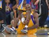 Los Angeles Lakers guard Kobe Bryant grimaces after being injured during the second half of their NBA basketball game against the Golden State Warriors, Friday, April 12, 2013, in Los Angeles. The Lakers won 118-116. (AP Photo/Mark J. Terrill)