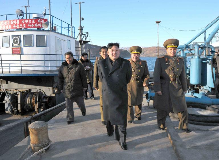 A KCNA handout photo provided on December 16, 2013 shows North Korean leader Kim Jong-Un (C) visiting the August 25 Fisheries Station under Korean Peoples&#39; Army 313 Unit