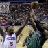 Boston Celtics' Paul Pierce, right, goes up for a shot as Philadelphia 76ers' Arnett Moultrie defends in the first half of an NBA basketball game, Friday, Dec. 7, 2012, in Philadelphia. (AP Photo/Matt Slocum)