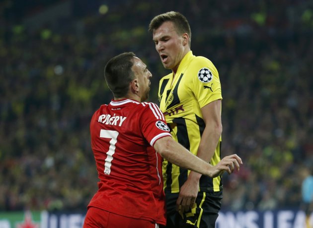 Borussia Dortmund's Kevin Grosskreutz clashes with Bayern Munich's Franck Ribery during their Champions League Final soccer match at Wembley Stadium in London