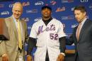 New York Mets general manager Sandy Alderson, left and COO Jeff Wilpon, right, pose with outfielder Yoenis Cespedes after a baseball press conference at CitiField in New York, Wednesday, Feb. 3, 2016. Cespedes agreed to a $75 million, three-year deal with the team. (AP Photo/Kathy Willens)