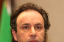 In this picture taken on January 5, 2015, released by the Syrian National Coalition Media Office, Khaled Khoja, the head of the Syrian National Coalition, speaks during a press conference, in Istanbul, Turkey. A Russian initiative to host peace talks this month between the Syrian government and its opponents appears to be unraveling, as prominent Syrian opposition figures shun the planned negotiations over concerns that the framework is flawed and holds little chance of success. (AP Photo/The Syrian National Coalition Media Office)