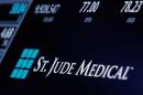 The ticker and trading information for St. Jude Medical is displayed where the stock is traded on the floor of the NYSE