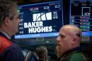 Traders work by the post that trades Baker Hughes on the floor of the New York Stock Exchange
