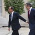 France’s President Francois Hollande, left,  welcomes Greece's Prime Minister Antonis Samaras at the Elysee Palace, Saturday, Aug. 25, 2012. As the country's Prime Minister, Antonis Samaras, heads around Europe for top-level talks on Greece's attempts to right its finances, austerity-weary Greeks back home are preparing themselves for new pain amid fears that they may be kicked out of the 17-country group that uses the euro. (AP Photo/Michel Euler)