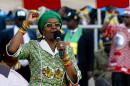 Grace Mugabe raises her fist as she addresses a rally in Harare on July 28, 2013