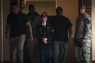 Private First Class Bradley Manning, 25, is escorted out of court after the second day of deliberation in his military trial at Fort Meade, Maryland July 28, 2013. REUTERS/James Lawler Duggan