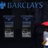 A woman walks past a line of Barclays cash dispensers in central London