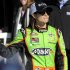 NASCAR Sprint Cup Series driver Danica Patrick, of the number 10 car, waves to the crowd as she makes her way into victory lane to celebrate securing the pole position for the upcoming Daytona 500, with fellow Sprint Cup driver and inside pole winner Jeff