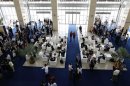 People sit in the reception at the World Economic Forum in Naypyitaw