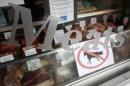 A "no horsemeat" sign is exhibited alongside meats in the window of Bates Butchers at Market Harborough, central England