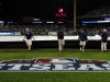 Grounds crew members cover the field during a rain delay at Game 4 of the American League championship series between the Detroit Tigers and New York Yankees Wednesday, Oct. 17, 2012, in Detroit. (AP Photo/Paul Sancya )
