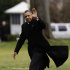 President Barack Obama waves as he steps off the Marine One helicopter and walks on the South Lawn at the White House in Washington, Thursday, Dec. 27, 2012, as he returned early from his Hawaii vacation for meetings on the fiscal cliff. (AP Photo/Charles Dharapak)