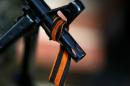 File photo of a black and orange ribbon of St. George tied to the machine gun of a pro-Russian armed man in Slaviansk