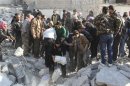 Free Syrian Army fighters and civilians search for bodies under rubble after an air strike by a fighter jet loyal to Syrian President Bashar al-Assad in Aleppo's al-Marja district