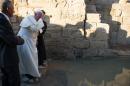 In this photo provided by the Vatican newspaper L'Osservatore Romano, Pope Francis visits Bethany beyond the Jordan river, the site of Christ's baptism, west of Amman, Jordan, Saturday, May 24, 2014. The pontiff is in Jordan on the first of a three day trip to the Middle East that will also take him to the West Bank and Israel. (AP Photo/Osservatore Romano, Pool)