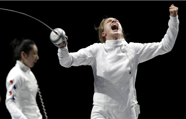 Germany's Heidemann celebrates defeating South Korea's Shin during their women's epee individual semifinal fencing competition at the ExCel venue at the London 2012 Olympic Games