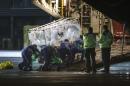 A nurse diagnosed with Ebola after returning from Sierra Leone is wheeled in a quarantine tent trolley onto a Hercules Transport plane at Glasgow International Airport on December 30, 2014