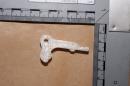 Undated handout photo made available by Greater Manchester Police in northern England Friday Oct. 25, 2013 of a plastic gun trigger made with a 3D printer which was found by officers during a raid on suspected gang members in the Bagley area of Manchester. Police said Friday that if the gun were viable it would be the first such seizure in Britain. (AP Photo/Greater Manchester Police)