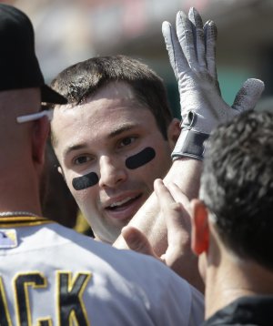 Pirates beat Reds 8-3 for home-field advantage