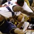 Washington Wizards center Earl Barron, top, dives for the ball as Indiana Pacers forward Sam Young holds on to it, during the first half of an NBA basketball game Monday, Nov. 19, 2012, in Washington.( AP Photo/Alex Brandon)