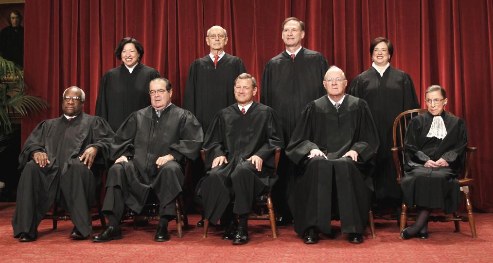 FILE - This Oct. 8, 2010 file photo shows the justices of the U.S. Supreme Court at the Supreme Court in Washington. Seated from left are Associate Justices Clarence Thomas, and Antonin Scalia, Chief Justice John Roberts, Associate Justices Anthony M. Kennedy and Ruth Bader Ginsburg. Standing, from left are Associate Justices Sonia Sotomayor, Stephen Breyer, Samuel Alito Jr., and Elena Kagan.  The Supreme Court on Thursday, June 28, 2012, upheld the individual insurance requirement at the heart of President Barack Obama's historic health care overhaul. (AP Photo/Pablo Martinez Monsivais, File)