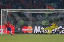 Chile's Alexis Sanchez, left, scores the winning penalty past Argentina's goalkeeper Sergio Romero during a penalty shoot out at the end of the Copa America final soccer match at the National Stadium in Santiago, Chile, Saturday, July 4, 2015. (AP Photo/Andre Penner)