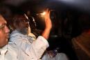 Ali Ahsan Mohammad Mujahid, deputy chief of Bangladesh Jamaat-e-Islami waves from a car as police arrest him in Dhaka