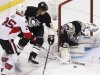 Pittsburgh Penguins goalie Fleury blocks a shot by Otttawa Senators' Neil as Penguins' Engelland tries to defend in their NHL hockey game in Pittsburgh