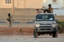 Libyan men loyal to rogue general Khalifa Haftar during clashes against Islamists in Benghazi on June 2, 2014
