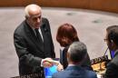 Riyad H. Mansour (L), Palestine's Ambassador to the United Nations, shakes hands with other delegates before a Security Council meeting about the situation in Gaza July 22, 2014 at UN headquarters in New York