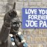 Signs and flowers are seen at the statue of the late Penn State football coach Paterno in State College
