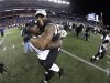 In this file photo taken Jan. 20, 2013, Baltimore Ravens inside linebacker Ray Lewis, right, celebrates with Vonta Leach after the NFL football AFC Championship football game against the New England Patriots in Foxborough, Mass. The Ravens are scheduled to face the San Francisco 49ers in Super Bowl XLVII in New Orleans on Sunday, Feb. 3. Leach's job is to get involved in a collision so  Rice won't. (AP Photo/Matt Slocum, file)