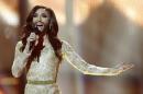 Singer Conchita Wurst representing Austria performs the song 'Rise Like a Phoenix' during the final of the Eurovision Song Contest in the B&W Halls in Copenhagen, Denmark, Saturday, May 10, 2014. Wurst won the competition. (AP Photo/Frank Augstein)