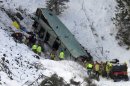 Emergency personnel respond to the scene of a multiple-fatality accident after a tour bus careened through a guardrail along an icy highway and fell several hundred feet down a steep embankment, authorities said, Sunday, Dec. 30, 2012 about 15 miles east of Pendleton, Ore. The charter bus carrying about 40 people lost control around 10:30 a.m. on the snow- and ice-covered lanes of Interstate 84, according to the Oregon State Police. (AP Photo/East Oregonian, Tim Trainor)
