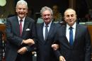 L-R: Turkey's European Affairs Minister Volkan Bozkir, Luxembourg's Foreign Minister Jean Asselborn and Turkey's Foreign Minister Mevlut Cavusoglu pose at the start of an EU-Turkey Intergovernmental accession conference on December 14, 2015