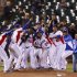 The Dominican Republic team celebrates after defeating the Netherlands during their semi-final World Baseball Classic game in San Francisco