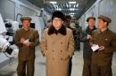 North Korean leader Kim Jong-Un (C) at the Tonghungsan Machine Plant under the Ryongsong Machine Complex in South Hamgyong Province, in an undated photo released by KCNA on April 2, 2016