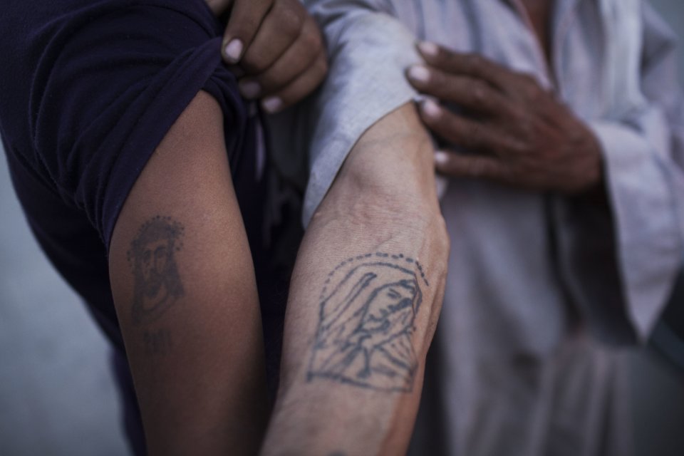 Coptic Christian men show their religious tattoos at Al-Mahraq monastery in Assiut, Upper Egypt, Tuesday, Aug. 6, 2013. Islamists may be on the defensive in Cairo, but in Egypt's deep south they still have much sway and audacity: over the past week, they have stepped up a hate campaign against the area's Christians. Blaming the broader Coptic community for the July 3 coup that removed Islamist President Mohammed Morsi, Islamists have marked Christian homes, stores and churches with crosses and threatening graffiti. (AP Photo/Manu Brabo)