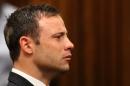 Olympic sprinter Oscar Pistorius listens to the verdict in his trial at the High Court in Pretoria, on September 12, 2014